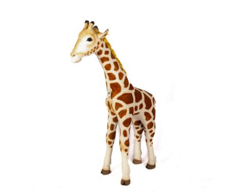 Steiff plush standing baby giraffe. Steiff button and yellow tag, number 502170. With original name tag. Dimensions: 25"L x 8