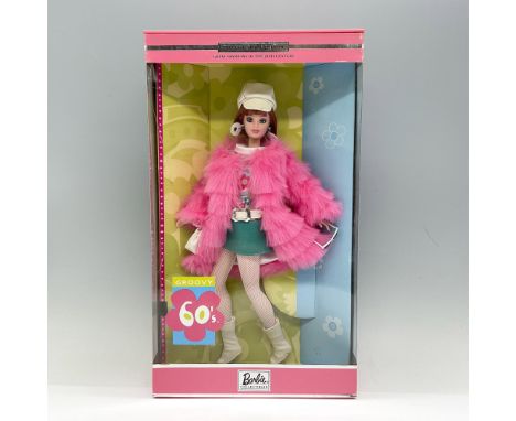 Mod sensation doll in a belted blue turquoise skirt and hot pink plush jacket, capturing the essence of the colorful sixties 