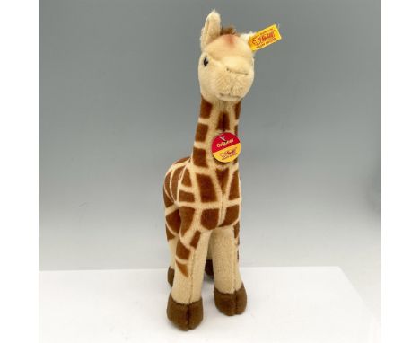 Soft toy colored in brown and cream with black eyes. Steiff ear tag. Issued: 20th centuryDimensions: 3"L x 5"W x 13"HManufact