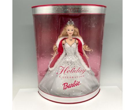 New in Box, never opened. Dressed in shimmering crystalline gown in winter white, wearing a tiara and fur wrap. Mattel backst