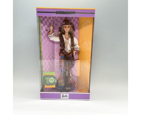 A Barbie Collectibles, and the seventh in the Great Fashions of the 20th Century collection. Barbie is shown in a long sandy-