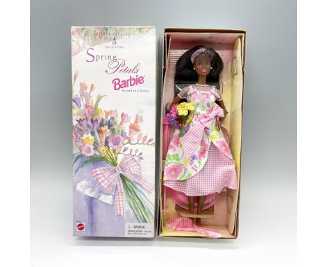 A special edition and Avon exclusive, second in a series. Barbie in an adorable pink floral dress holding a bouquet of flower