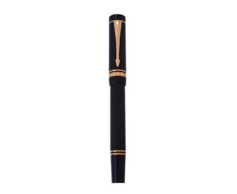 Parker, Duofold International, a black roller ball pen, the cap with gilt arrow clip and double cap band
