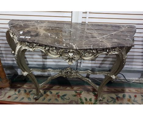 Georgian style marble top console table, the veined grey marble top with moulded serpentine edge, above a carved silver gilt 