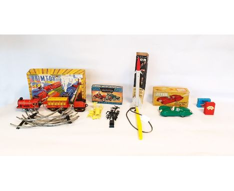 Quercetti missile Tor, a Jetex racing car, a plastic vintage car set, a Brimtoy tinplate train set and a pocket ashtray (all 