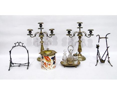 Pair of silver plate twin branch candelabra, a cruet stand with four bottles, a rustic bottle holder, another and a Ridgeways