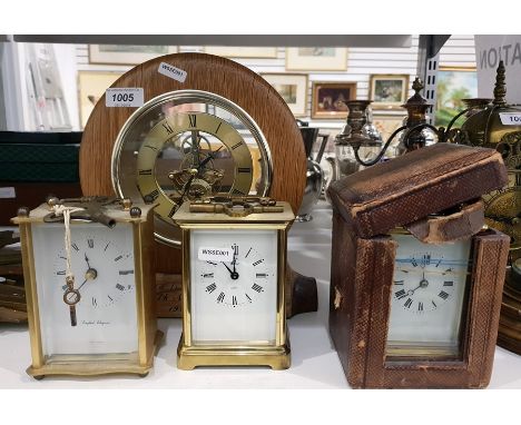 Presentation circular oak framed mantel clock with visible battery-driven movement, two quartz movement carriage clock and an