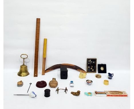 Assorted collectables including a boomerang, model of a Mini, bell doorstop, boxed camera, a mother-of-pearl and shell flower