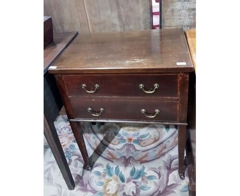 Late 19th/early 20th century mahogany two-drawer dressing chest raised on square tapering supports with ceramic castors, 64cm