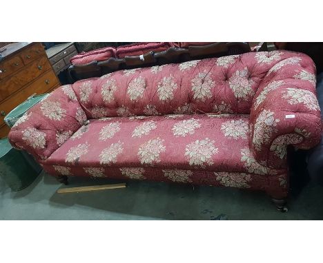 19th century Chesterfield settee with floral deep buttoned upholstery, turned supports and ceramic castors 