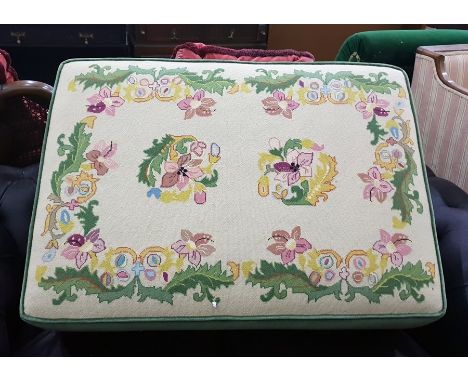 Machine petit point upholstered pouffe on brass castors