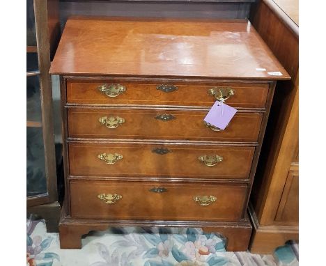 Burr walnut veneered reproduction chest of four graduated drawers, on bracket feet, 63cm wide 