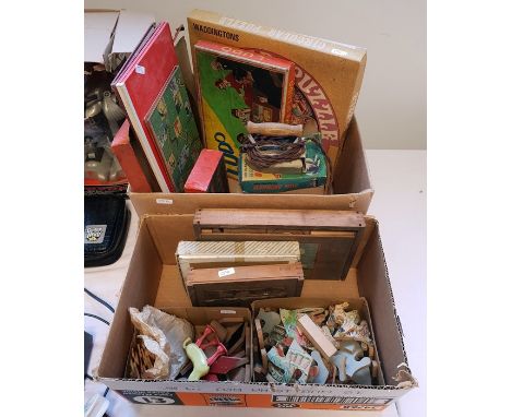 Two boxes of assorted board games, puzzles, cards including Lledo, Lotto, etc and a mechanical begging dog together with  a s