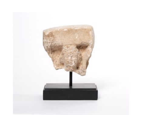 Stone fragment head possibly 14th/15th Century, carved as if forming the capital of a small pillar, on a later stand, 10cm x 