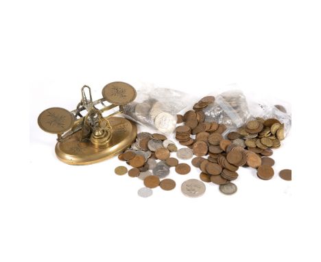 Set of brass balance scales with foliate decoration and a collection of commemorative coins 