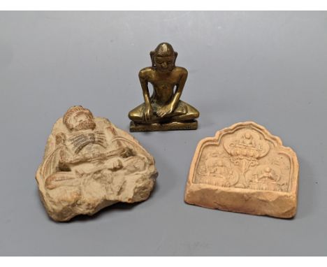 A small bronze seated figure of Buddha and two clay Buddhist  tablets, largest 8 cm