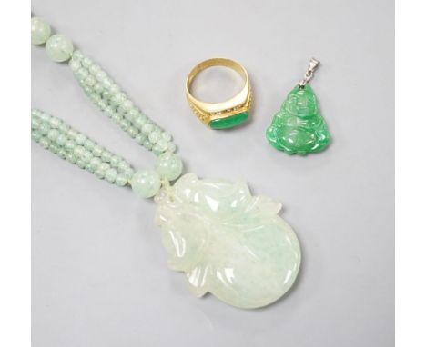 A carved jade pendant, 53mm on a quartz bead necklace, one other jade pendant and a jade, paste and gilt metal ring.