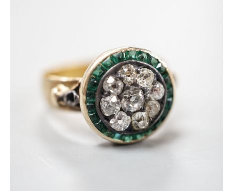 A George V 22ct gold emerald? and diamond set circular cluster ring, the shank with engraved inscription, size N/O, gross wei