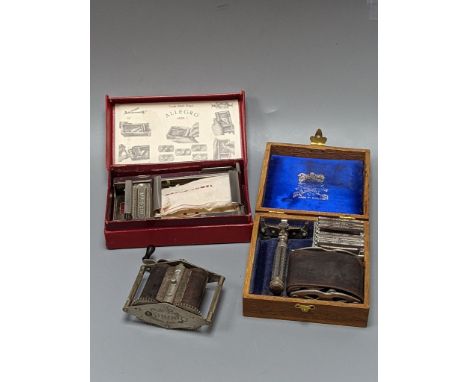 A group of cased vintage safety razors and shavers and four strops