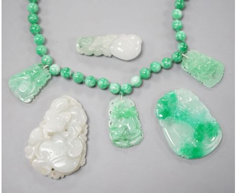 A jade bead necklace hung with three jade carvings, 49cm and three other jade carvings.
