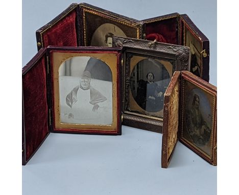 A 19th century cased Daguerreotype of a lady, six cased Ambrotype portraits and three 19th/20th century albums/diaries (10 it