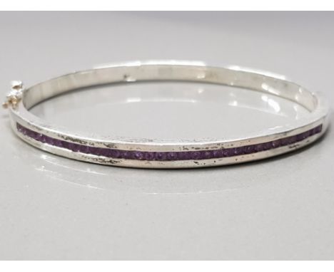 A SILVER AND AMETHYST BANGLE STAMPED 925 27G GROSS