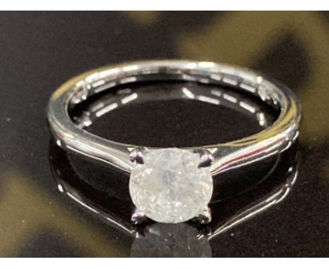 AN 18CT WHITE GOLD AND DIAMOND SOLITAIRE RING F COLOUR I3 CLARITY SIZE L 1/2 2.7G GROSS CERTIFIED WITH INDEPENDENT VALUATION 