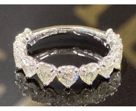 AN 18CT WHITE GOLD AND DIAMOND 2/3 ETERNITY RING THE HEART CUT DIAMONDS TOTALLING 2.89CTS VS CLARITY COLOUR J-K SIZE M 2.7G G