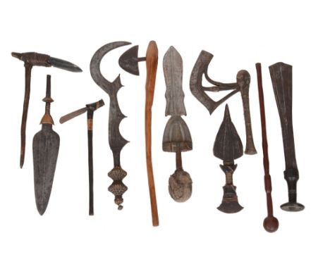  A group of African, Asian and Pacific weapons,   mainly 20th century, comprising;  seven African edged weapons  , some blade