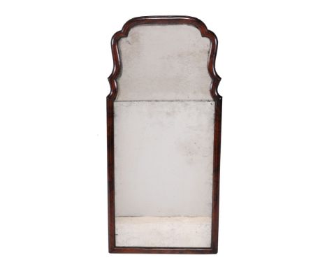  A mahogany framed wall mirror  , second quarter 18th century, the cushion frame surrounding two mirror-plates, 90cm high, 43
