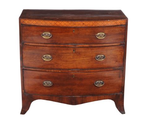  A Regency mahogany chest of drawers,   circa 1815, of bowfront outline, the cross-banded caddy top above decorative frieze a