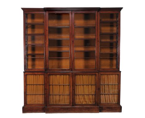  A Regency mahogany library bookcase  , circa 1815, of breakfront outline, the moulded cornice above central double and flank