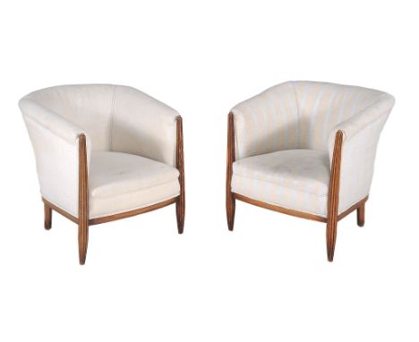 A pair of Art Deco tub chairs,   circa 1930, probably French, the stained beech frames with tapering reeded arm supports and