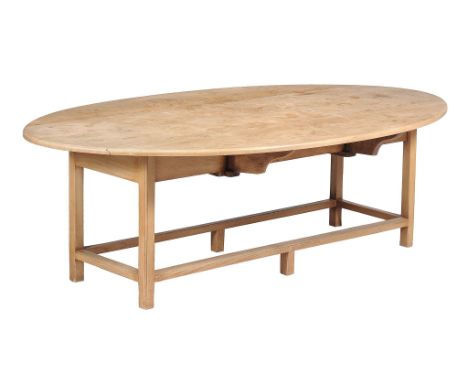  A light oak wake table, in mid 18th century style,   20th century,  the oval top with shallow drop leaves, above moulded squ