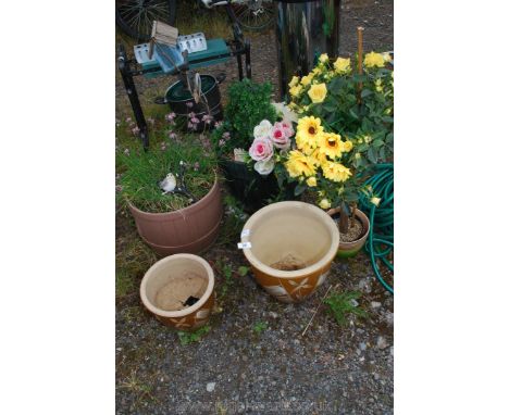 Two glazed terracotta planters, half barrel planter, artificial flowers etc.