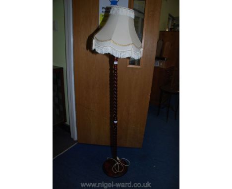 A BT style modern standard lamp with shade.