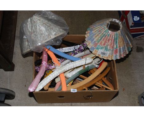 Coat hangers and two lamp shades.