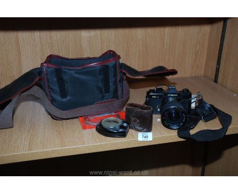 A Cosina model PM-1 camera, accessories and case.