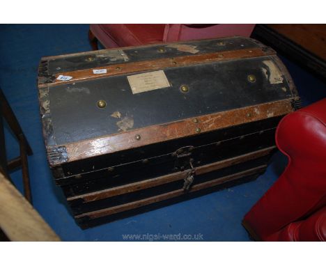 Domed top travel trunk.