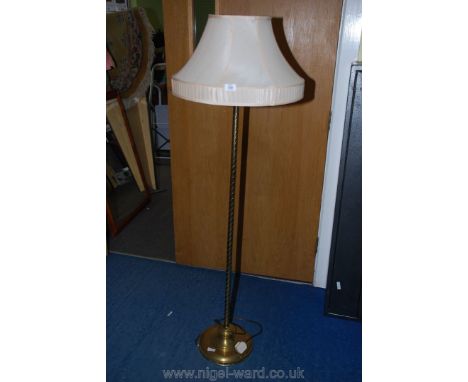 Brass standard lamp with shade.