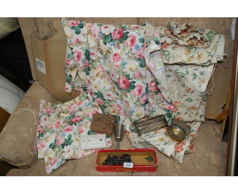 Floral curtains, metal ware and a Triang train.
