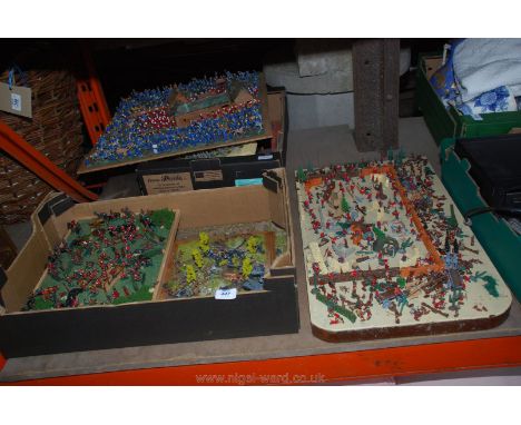 A large quantity of model army figures on boards etc.