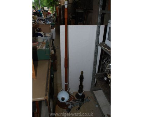 A wooden standard lamp, table lamp and angle poised lamp.