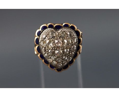 A yellow metal heart shaped ring set with twenty four old brilliant cut diamonds measuring from 2.00mm to 4.00mm. Approximate