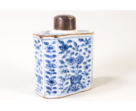 A Chinese porcelain tea caddy with white metal cover, painted in underglaze blue with flowers, 12cm high