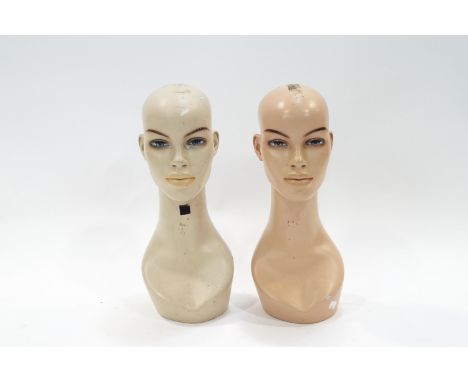Two shop mannequin heads with spray painted features, 43cm high