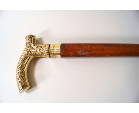 A malacca shafted brass handled walking stick