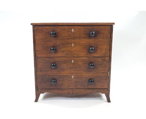 A George III mahogany commode with four faux drawers with later turned handles, 75cm high x 73cm wide x 50cm deep