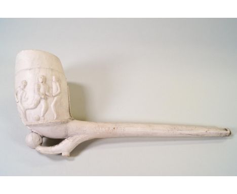 A white clay pipe moulded with football players, Rd No241593, 21cm long