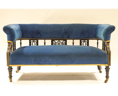 A Victorian aesthetic movement two seat sofa on turned legs, 132cm wide
